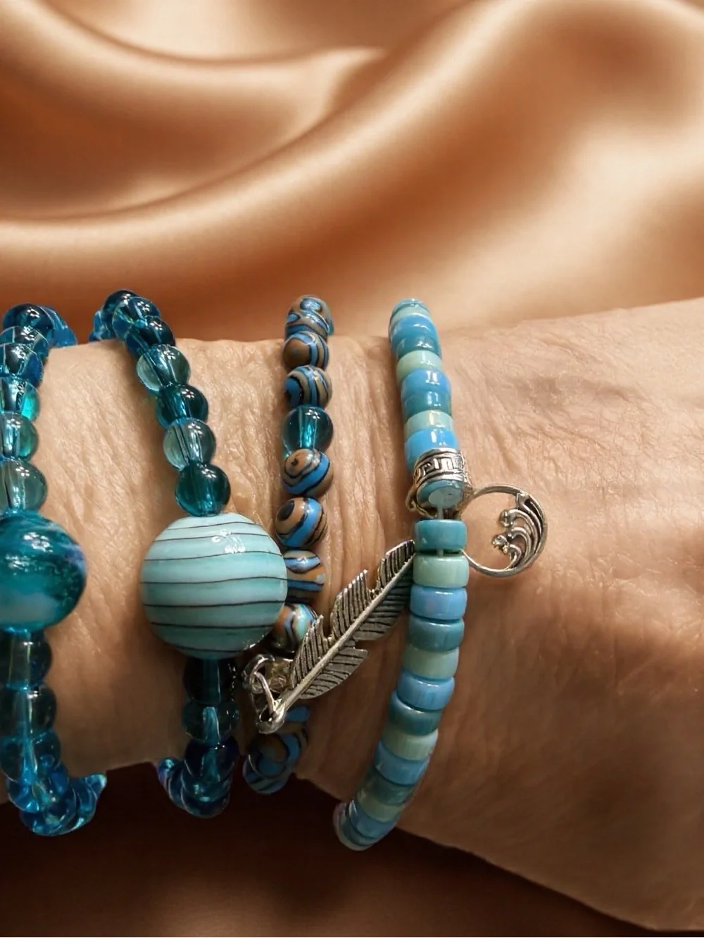 Hand Crafted Turquoise and Aqua Beaded Bracelet Set with Feather Charm